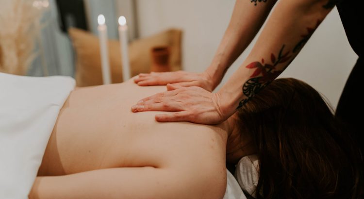 Woman getting a massage by a therapist