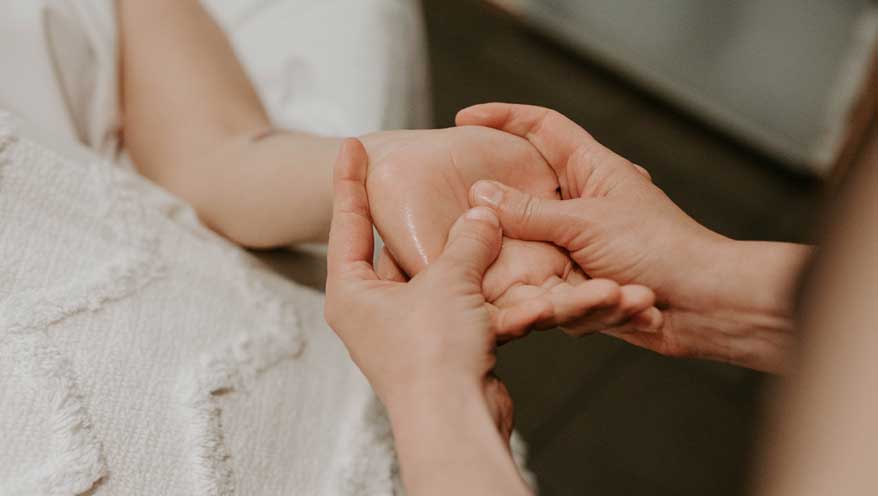 woman getting a hand massage