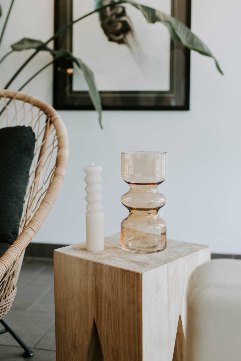 vase and candle on a table