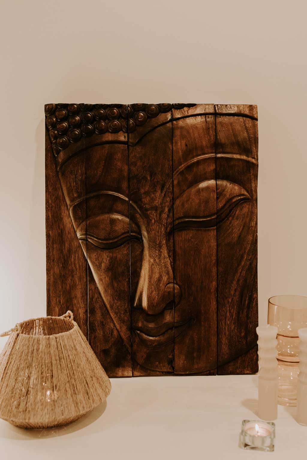 wooden carving of a face